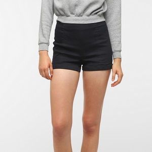 High-waisted black shorts with zipper and back pockets